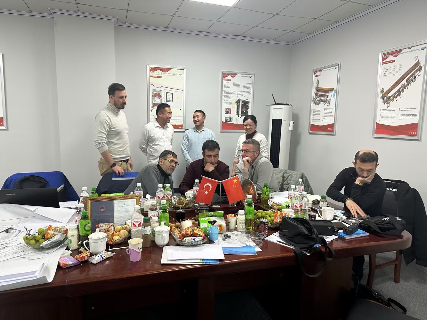 Buyer and manufacturer representatives in a commercial meeting in China